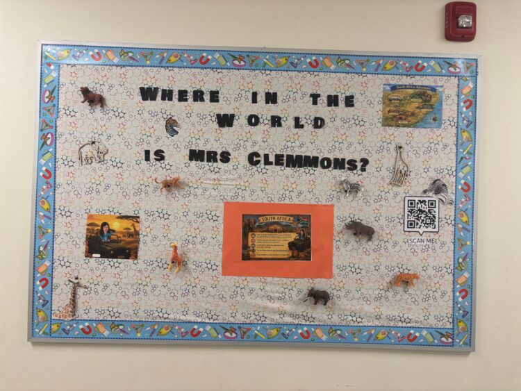 A bulletin board for an 8th grade class featuring African animals and a map of their teacher's journey.
